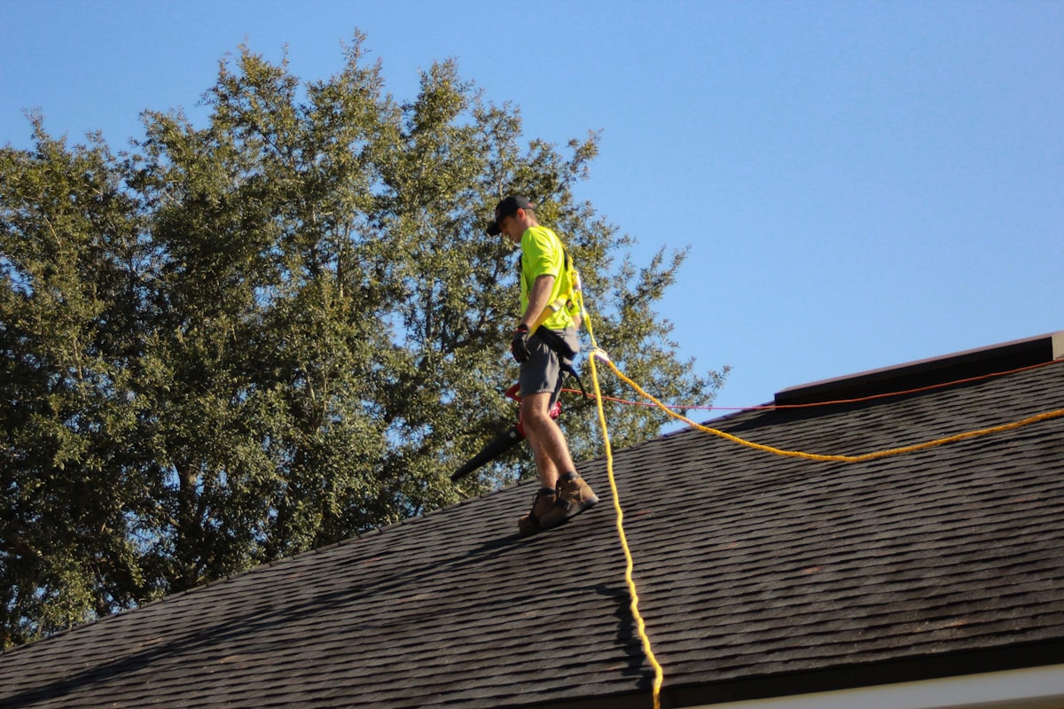 Bing Roofs crew member walking a freshly shingled roof in the Southern Tier